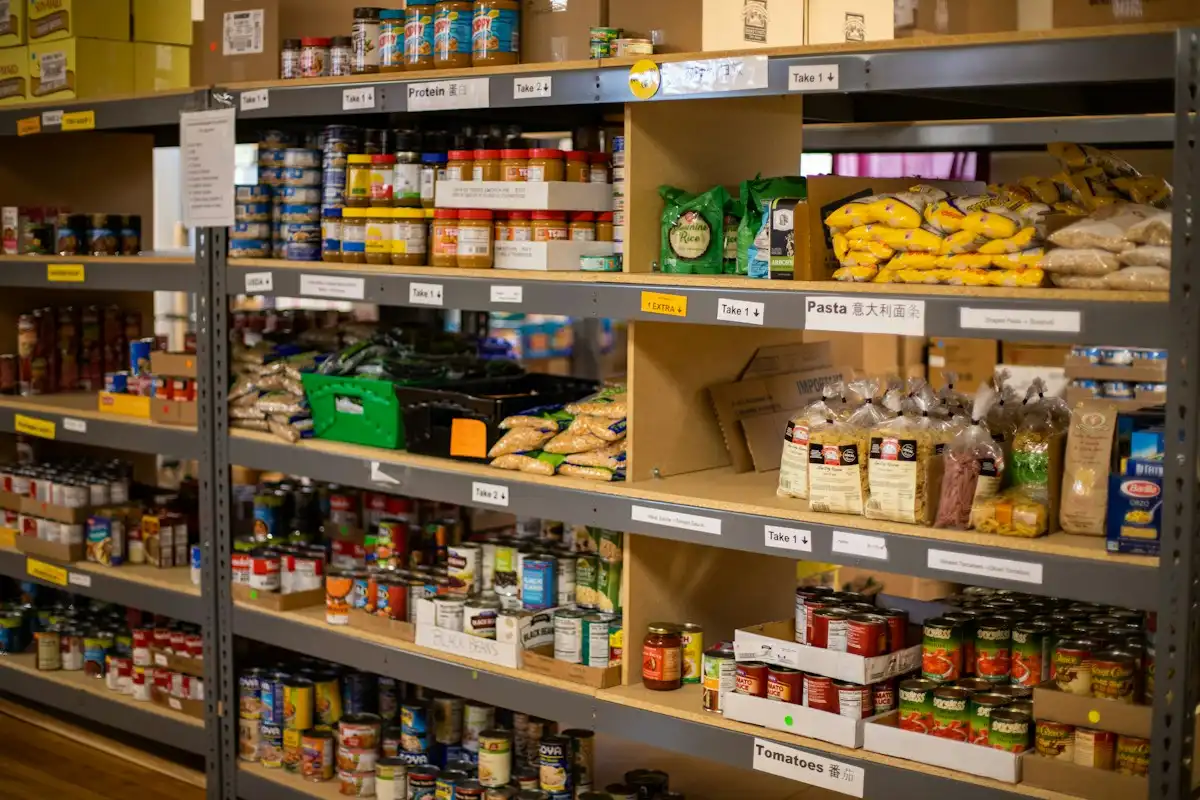 Shelves of donated food in a food bank store room
